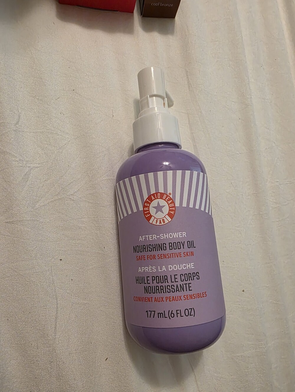 First Aid Beauty Lavender After-Shower Nourishing Body Oil - Purple Bottle